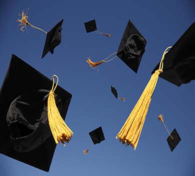 graduation caps in the air