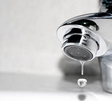 Faucet and Faucet Aerator dripping a drip of water