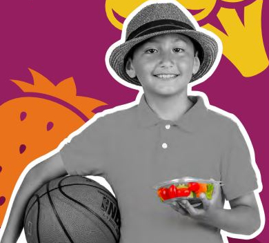 Young boy with basketball holding fruit