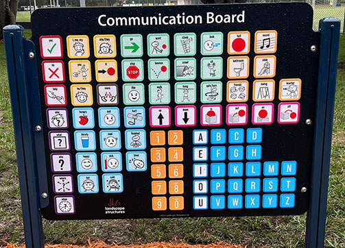 Communication Board with multiple colored squares with symbols, pictures and letters