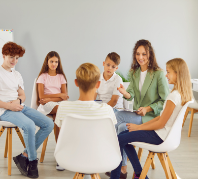 Students sitting around on chairs in a circle